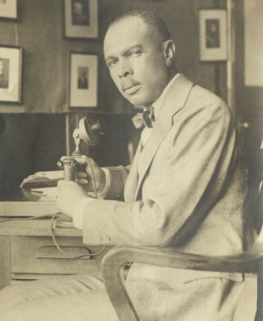 James Weldon Johnson using an old-timey telephone