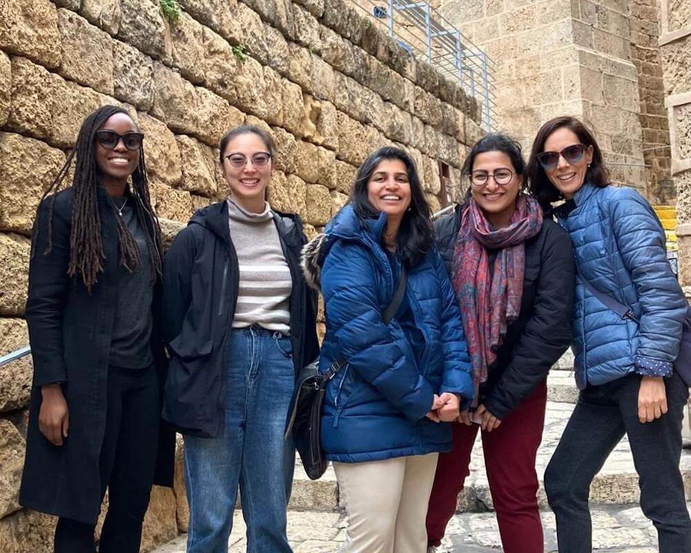 The group takes a guided walking tour in Jerusalem