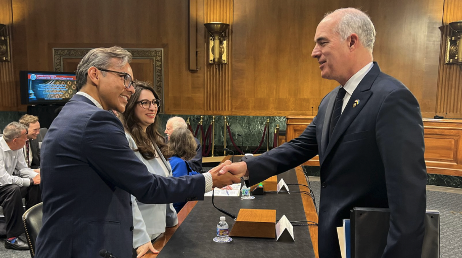 Dr. Gonzales shakes hands with Senator Bob Casey, Chairman of the United States Senate Special Committee on Aging