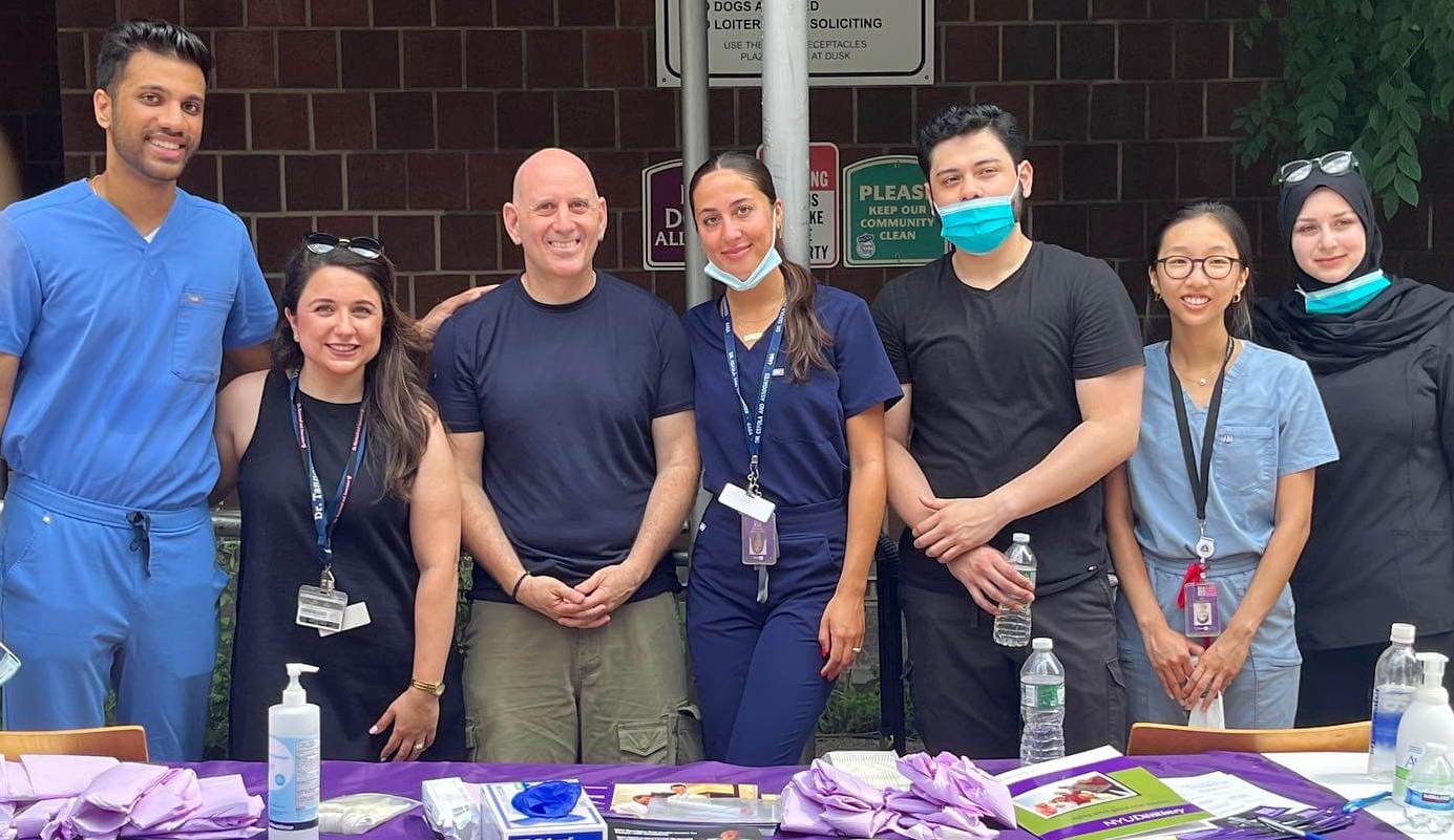 Cheryline Pezzullo and dental students at a community health fair for oral cancer screenings