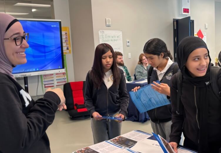 Batoul Saleh and students at a career fair