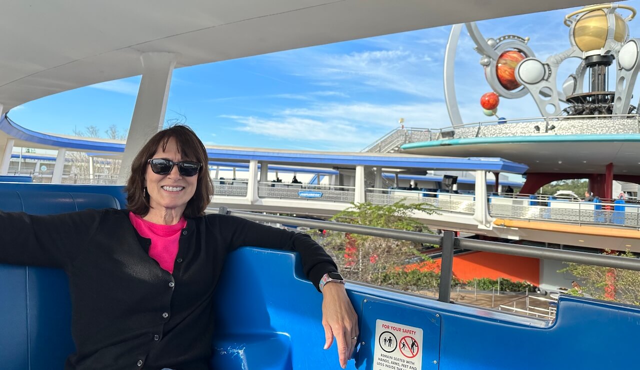 Brenda Talbot riding the PeopleMover in Disney World